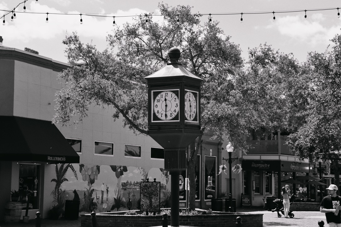 Black and white street scene with a clock in downtown Sanford