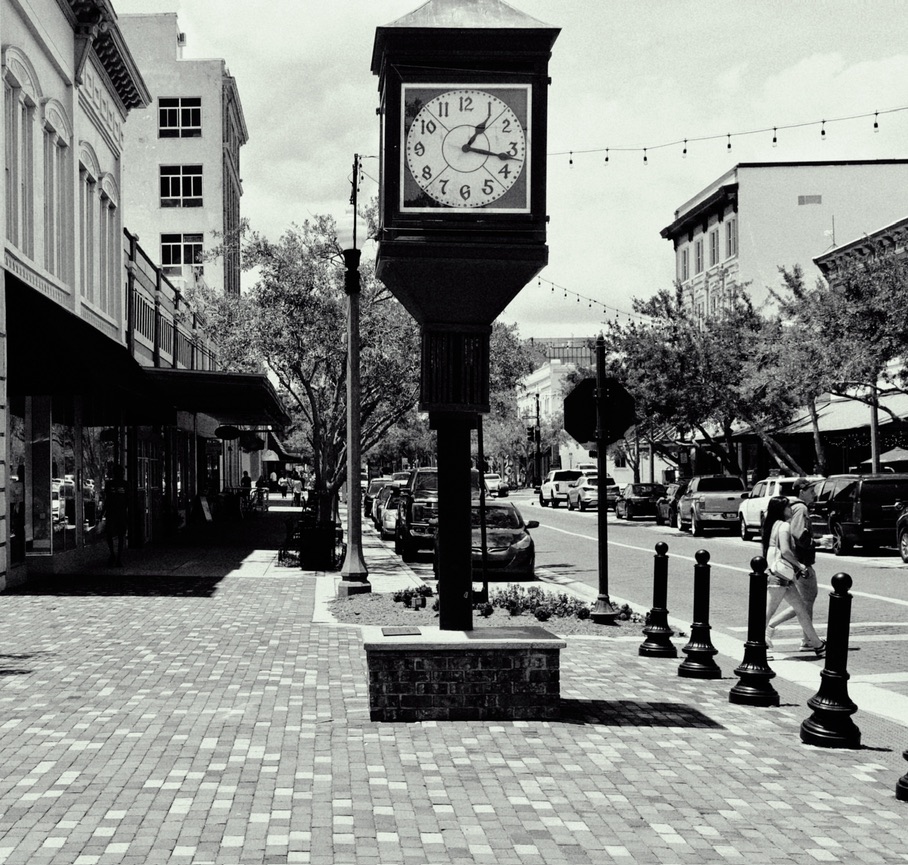 Black and white photo of a public clock in downtown Sanford